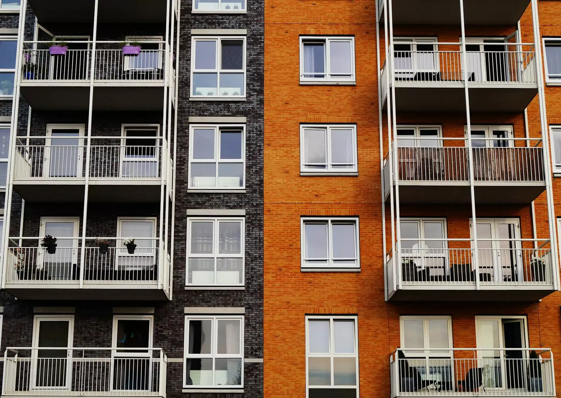 Apartment buildings with dark and orange brick facades